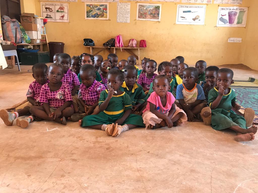 Image of Children in classroom holding their books